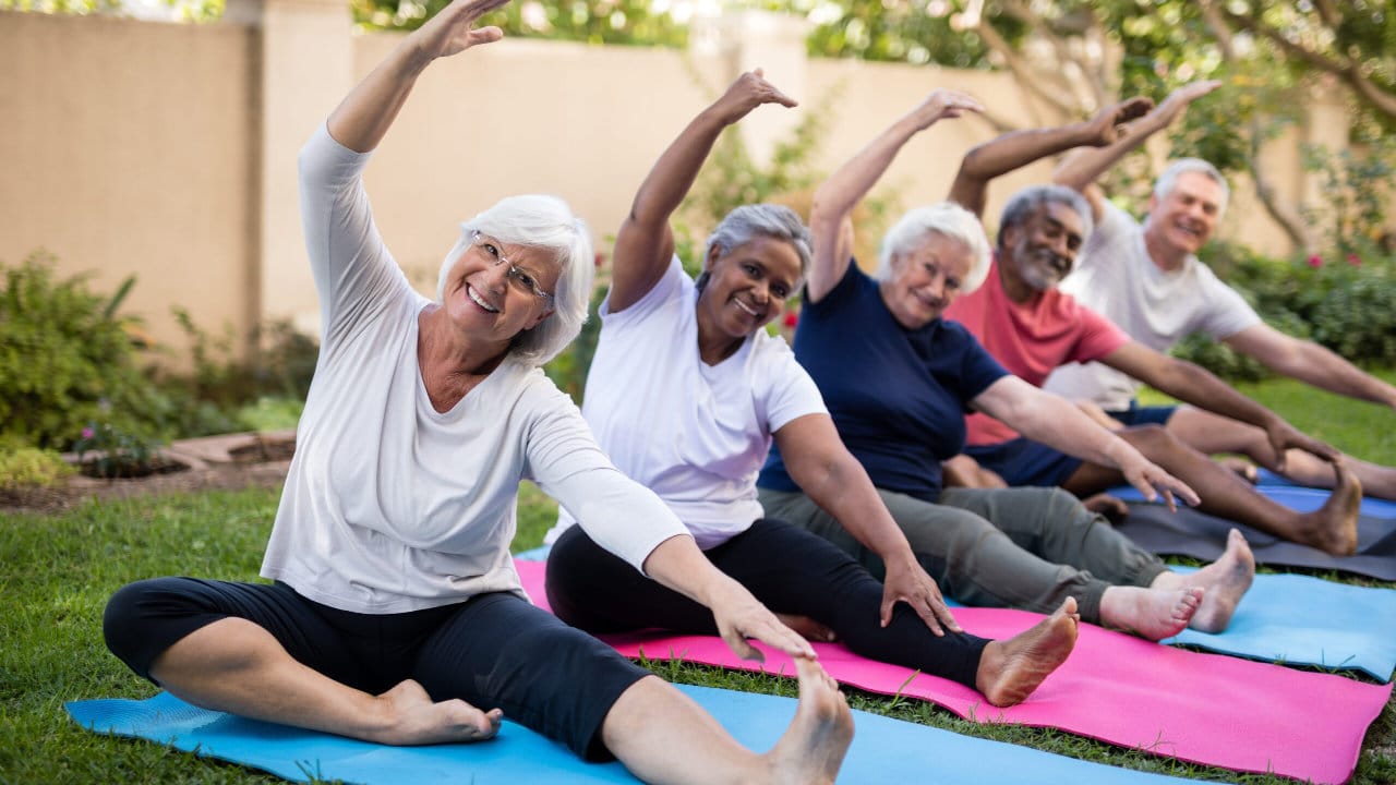 group of elderly people doing stretches